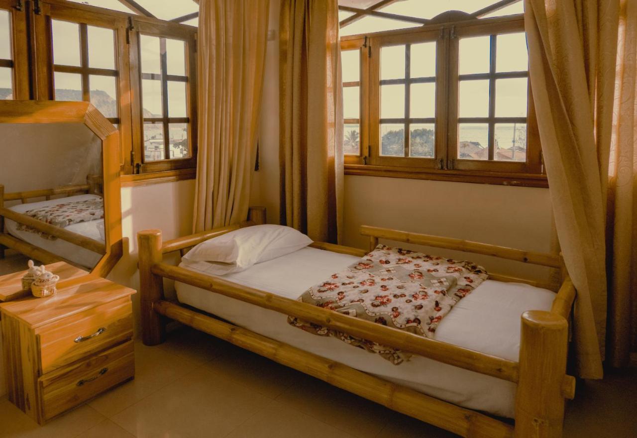Hostal Poseidon Puerto Cayo Extérieur photo